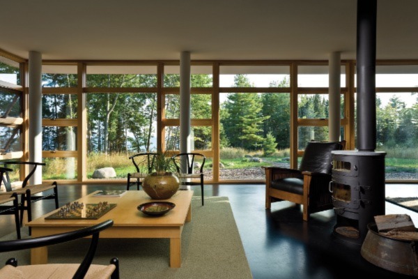 window wall looking out to lush green yard space
